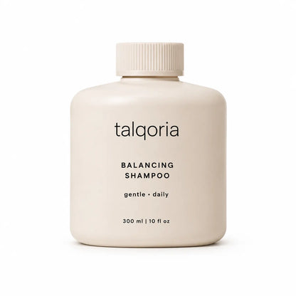 A 300 ml bottle of talqoria Balancing Shampoo in a soft cream color with black text, on a clean white background.